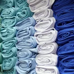 Rolls of colourful fabric in a textile store