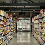 Supermarket aisle with groceries on shelves