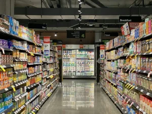Supermarket aisle with groceries on shelves