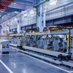Industrial production line with machinery in a factory hall