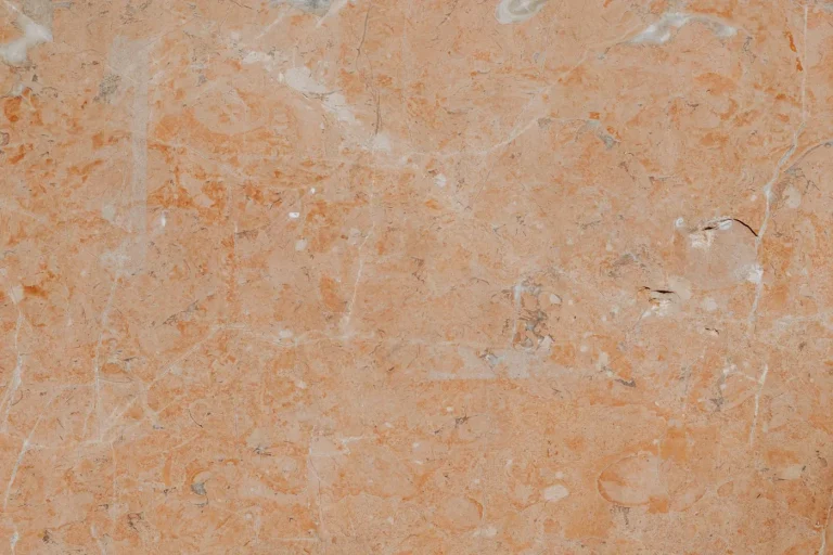 Warm rosa marble surface with natural veining