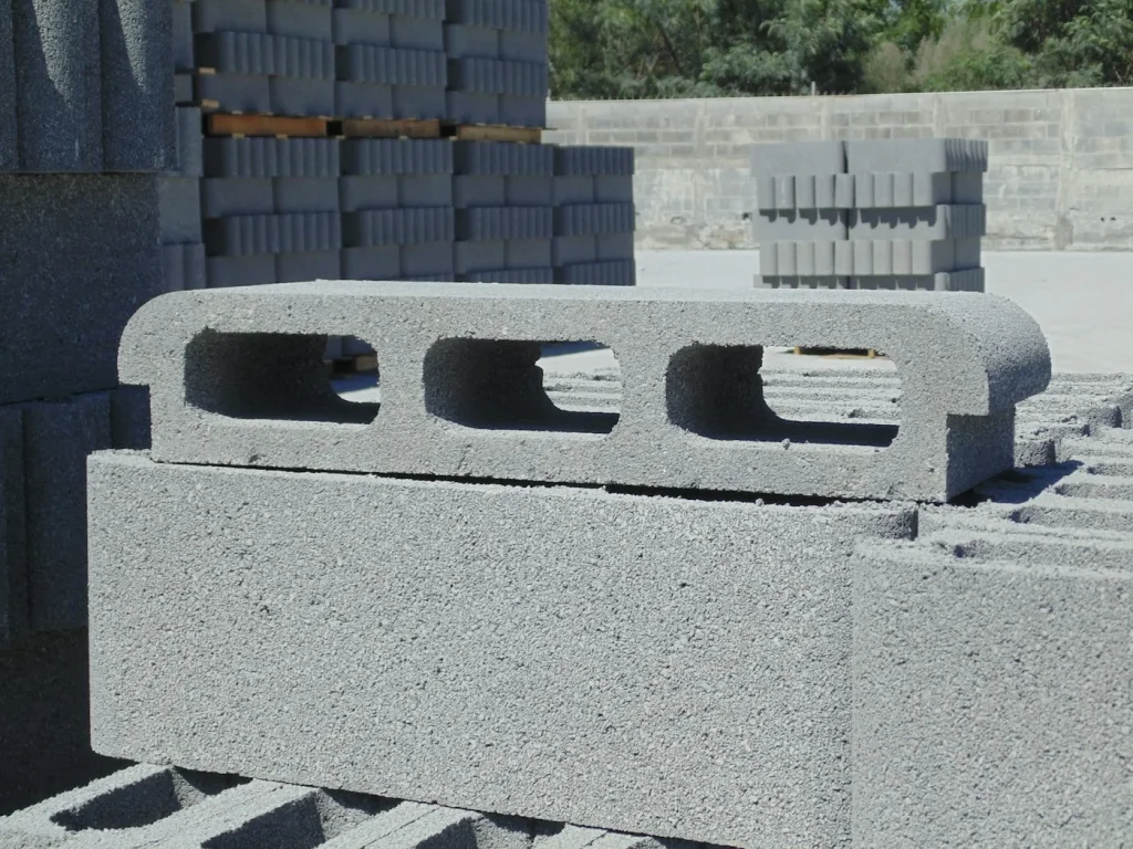 Precast concrete blocks stacked at a building materials yard