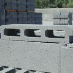 Precast concrete blocks stacked at a building materials yard