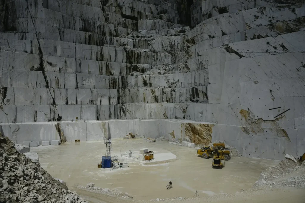 Stone cutting machine slicing a limestone block at a Hebron stone factory