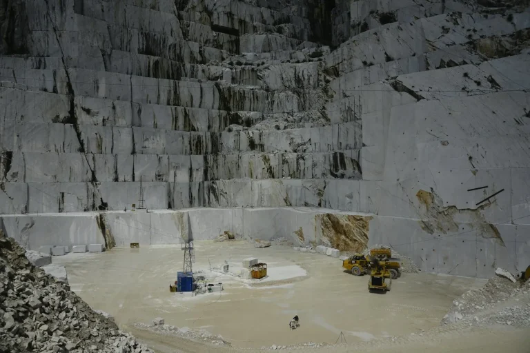 Stone cutting machine slicing a limestone block at a Hebron stone factory