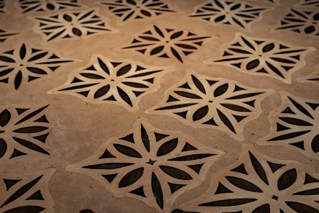 CNC-cut decorative stone panel with geometric pattern